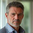 David, a 48-year-old man, appearing thoughtful and healthy, perhaps in a casual active setting.